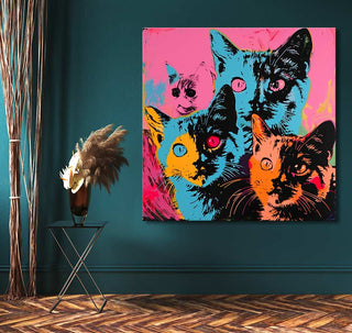 Andy Warhol signature - Cats 1: Pop art canvas featuring vibrant cat faces, displayed in a modern interior with herringbone floor and black side table.
