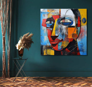 Corneille signature - Mr Smith: Abstract cubist face painting on teal wall, paired with minimalist metal table and dark vase with dried pampas grass.