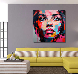 Françoise Nielly-signature painting, Monica in the Morning, bold abstract portrait on canvas, vibrant colors, displayed in a modern living room above a yellow sofa.
