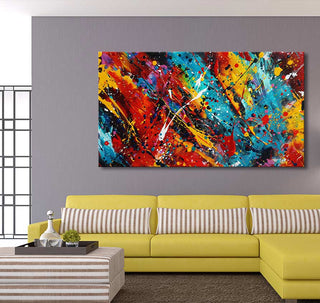 Jackson Pollock signature - Rodeo Drive: Abstract painting with vibrant splashes, mounted above a chartreuse L-shaped sofa with striped pillows, creating a bold, contemporary living room setting.