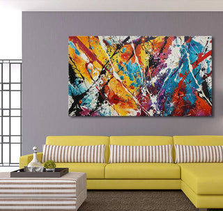 Bright yellow L-shaped sofa with tan-striped pillows, topped by Jackson Pollock signature painting, Winter Morning in vibrant abstract style, enhancing a modern living-room setting.