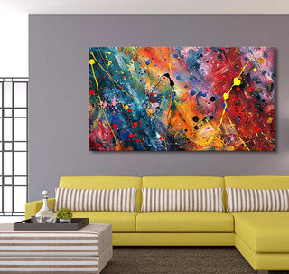 Modern living-room with Jackson Pollock-style painting, Summer Evening (90x60cm), above mustard-yellow sectional. Features abstract drip art in vibrant colors, perfect for expressive decor.