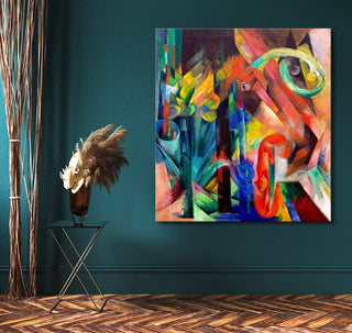 Franz Marc's Bos met Eekhoorns painting with vibrant abstract shapes, displayed in a modern room with pampas grass and a black-metal side table.