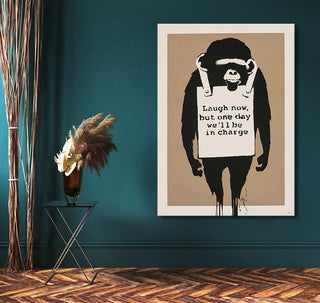 Banksy - Darwin was Right: Stencil-style chimpanzee print with graffiti art, displayed in a room with a side table and dried pampas grass.