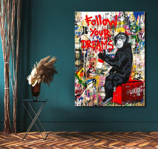 Banksy - Follow your Dreams: A vibrant street art canvas with a chimpanzee on a red crate, spray-painting 'FOLLOW YOUR DREAMS', perfect for pop art enthusiasts.