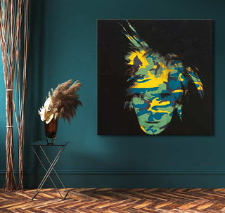 Andy Warhol signature - Camouflage painting in pop art style, featuring a bold multicolored face on a teal wall, next to a minimalist side table with dried grasses.