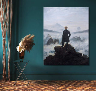 Hand-painted oil painting Caspar David Friedrich - Der Wanderer über dem Nebelmeer, showcasing a lone figure atop rocks in a misty landscape. Displayed in a minimalist room setting.