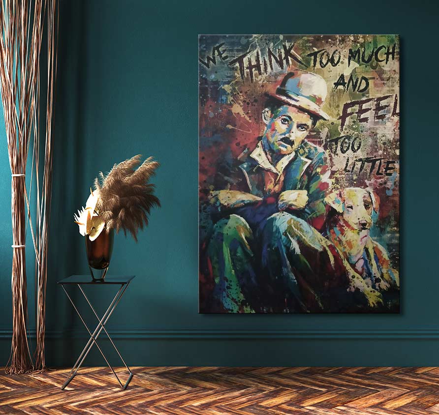 Charley Chaplin - Olieverf op canvas: A vibrant pop art painting of Charlie Chaplin with a dog, featuring the quote, WE THINK TOO MUCH AND FEEL TOO LITTLE.