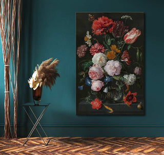 Still-life painting Jan Davidsz - De Heem featuring vibrant flowers, a butterfly, and a snail, displayed in a stylish teal interior with a modern side table.