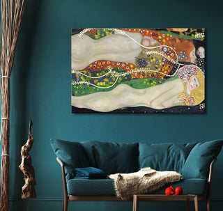 Gustav Klimt-inspired painting Waterslangen with two entwined nude figures, displayed in a modern art setting with teal loveseat and decorative elements.