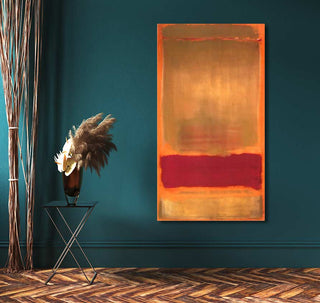 Abstract painting 'Golden Dawn' in Rothko style, featuring muted gold and crimson fields, on teal wall with a black metal side table and dried pampas grass.