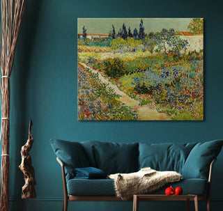 Vincent van Gogh's Tuin te Arles oil painting, impressionist garden scene, above teal sofa in cozy room setting. Perfect for art lovers and interior design.
