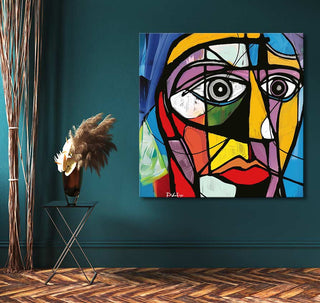 Picasso signature - Abstract Portret painting on teal wall, with black metal stand and bronze vase, showcasing modern cubist style in an interior setting.
