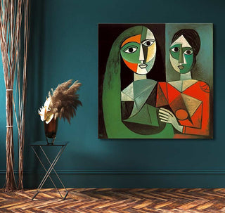 Cubist-style painting Hartsvriendinnen by Picasso, with abstract female figures. Displayed in a moody teal corner with pampas grass and a black tripod table.