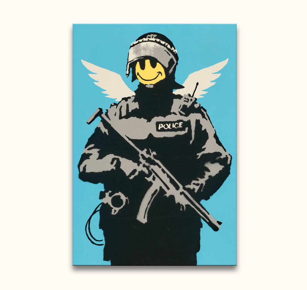 Banksy - Keep Smiling: A stencil-style artwork of a riot officer with angel wings and a smiley face, hand-painted on high-quality canvas, ready to hang.
