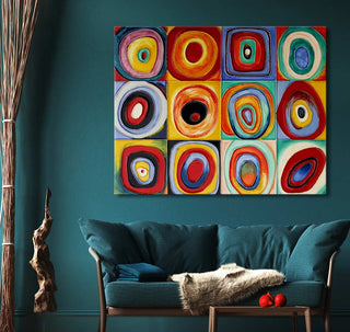 Wassily Kandinsky - Kleurstudie Kwadraten painting features concentric circles, adding vibrant modern art to a teal-accented living room with a sofa and decor elements.