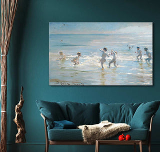 Peder Severin Krøyer's 'Jongens Baden bij Skagen Strand' painting above teal sofa, depicting children in ocean; impressionistic style, ideal for classic art lovers.