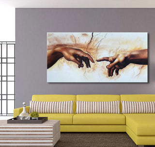 Michelangelo - Creatie van Adam (150x75cm) oil painting in a modern living room with a yellow sectional sofa and striped ottoman, enhancing contemporary interior design.