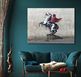 Banksy - Red Horseman: A vivid street-art piece featuring a white horse with a red-cloaked rider, adding a bold, modern touch to any living space.