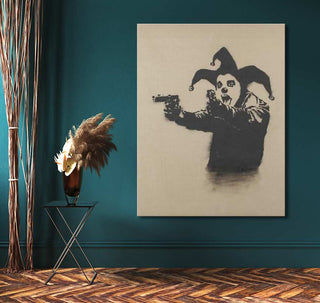 Banksy - Insane Clown: Monochrome stencil-style painting of a sinister clown aiming guns, mounted on a wooden frame, perfect for pop art enthusiasts.