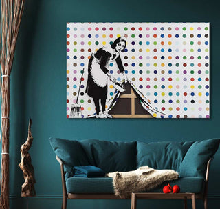 Banksy - Keep it Spotless: Pop-art canvas featuring a 1950s maid on teal wall, complemented by a teal sofa and minimalist decor.