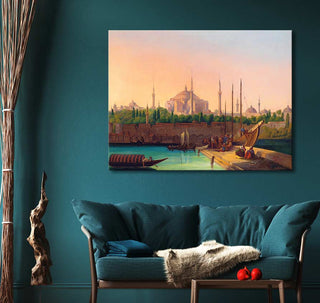 August Finke's Hagia Sophia, Istanbul oil painting, showcasing a 19th-century harbor scene with boats and figures, framed above a teal sofa in a cozy living-room setting.
