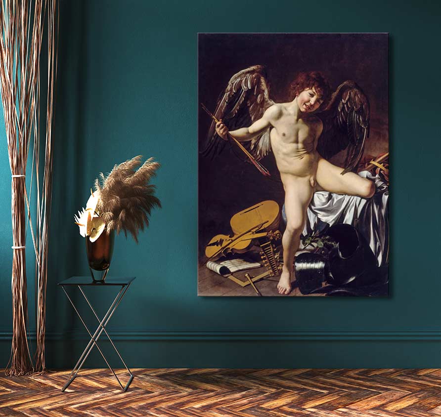 Caravaggio - Amor Vincit Omnia painting mounted on a deep teal wall, depicting a cherub with arrows amidst armor, alongside a metal table with pampas grass.