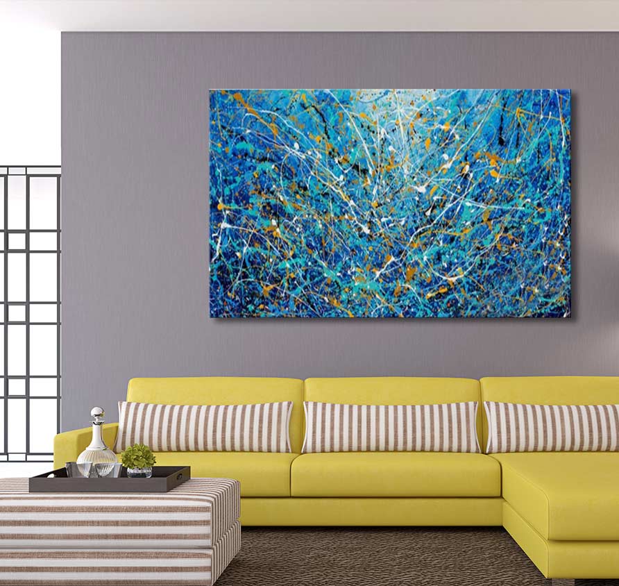 Abstract 'Aqua' painting in Pollock’s style, vibrant cobalt and gold drips, above a modern chartreuse sofa with striped accents in a contemporary living room setting.
