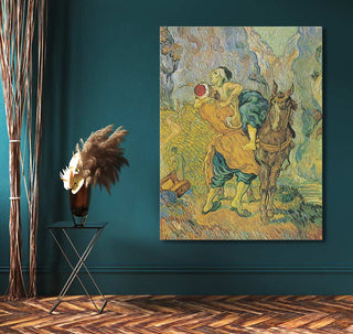 Vincent van Gogh's The Good Samaritan oil painting on teal wall with tripod table, pampas grass, and decorative twigs; ready-to-hang, UV-protected canvas.