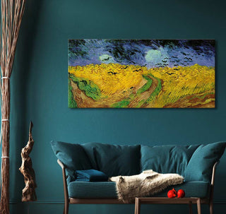 Teal living room with Van Gogh's Wheatfield with Crows canvas, mid-century sofa, wooden side table with red apples, complemented by organic décor.